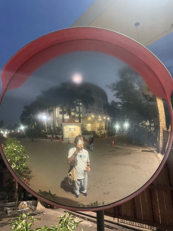 Nighttime selfie captured at illuminated Hindu temple in Mumbai