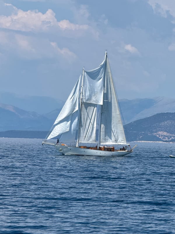 Sailboats and turquoise bays on a sunny Lefkimmi afternoon