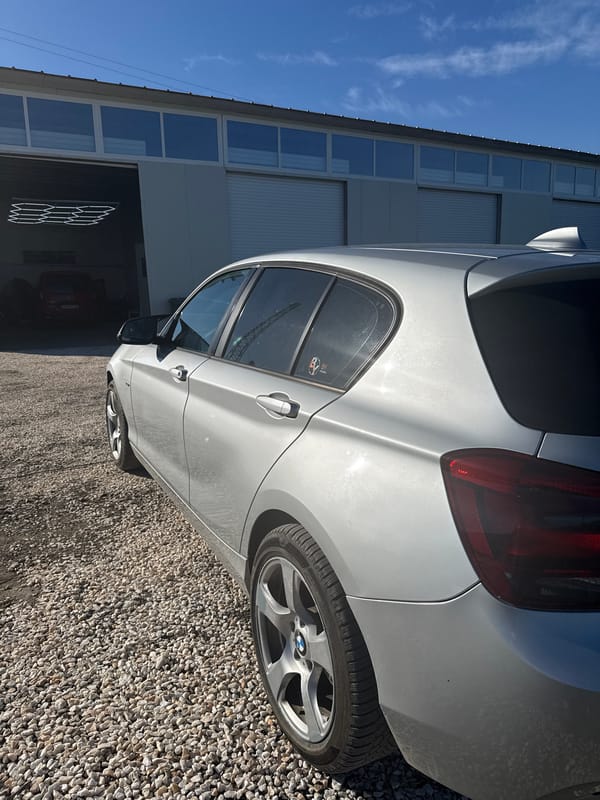 Silver BMW parked near garage in Branipole, Bulgaria