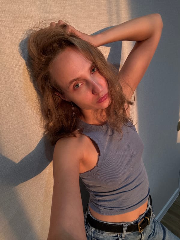 Indoor self-portrait session on a rug and textured wall
