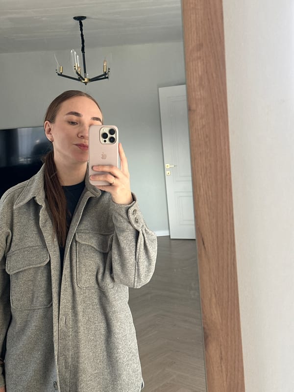 Woman takes mirror selfie in Kharnavy, Russia
