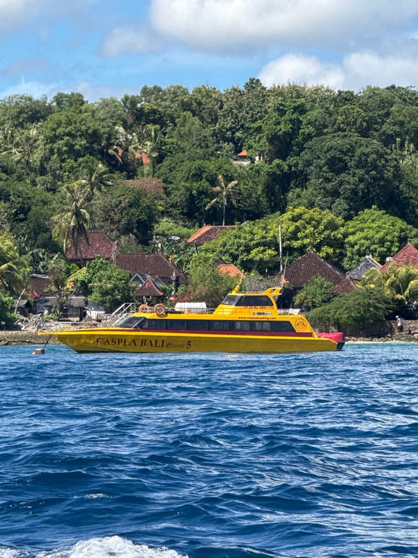 Boat tour captures scenic Nusa Penida coastline views