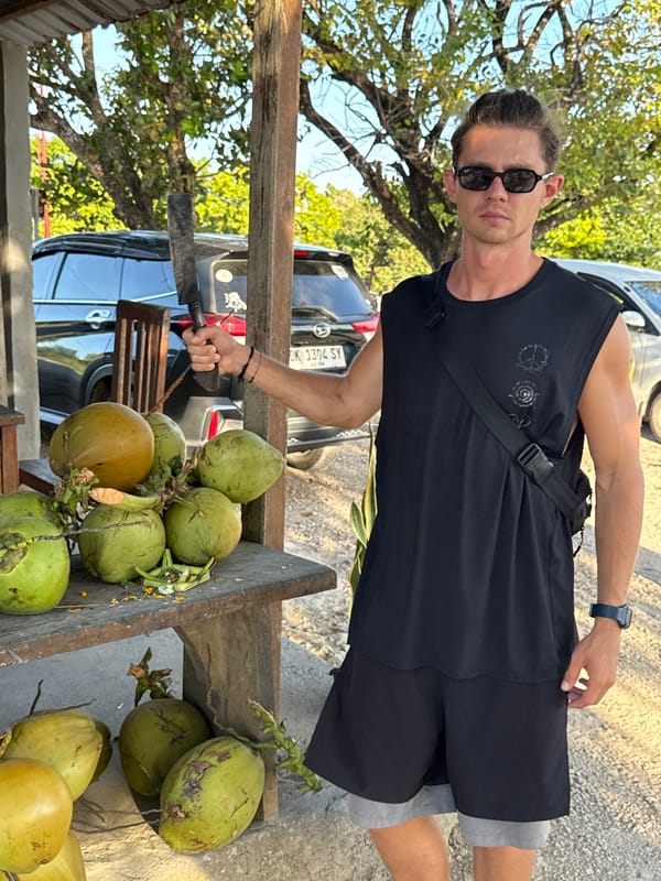 Coconut vendor with knife spotted at Nusa Penida stand