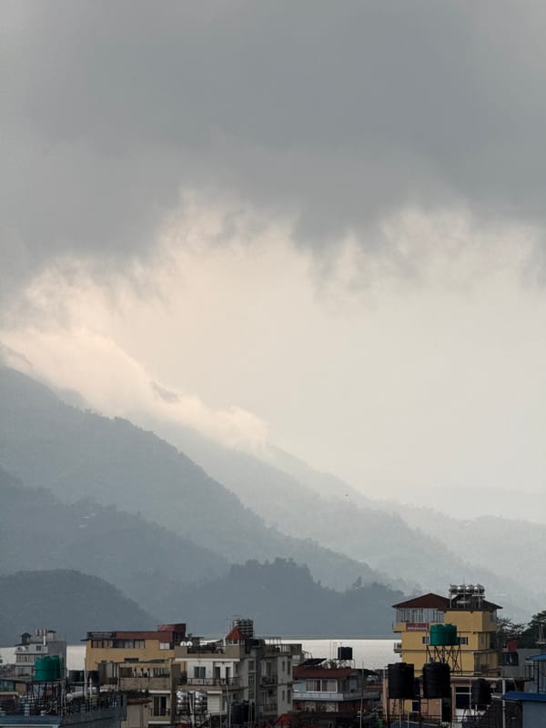 Cloudy morning shrouds Pokhara mountains in mist
