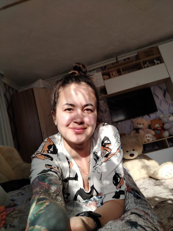 Woman takes selfies with houseplant in Гожан, Russia