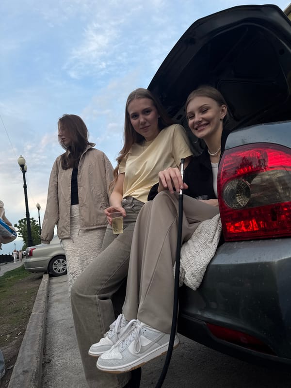 Young adults gather for casual outdoor socializing in Perm