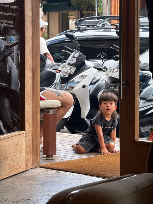 Child photographed through doorway in North Kuta, Indonesia