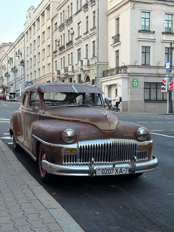 Minsk landmarks, vintage cars, and street life at golden hour
