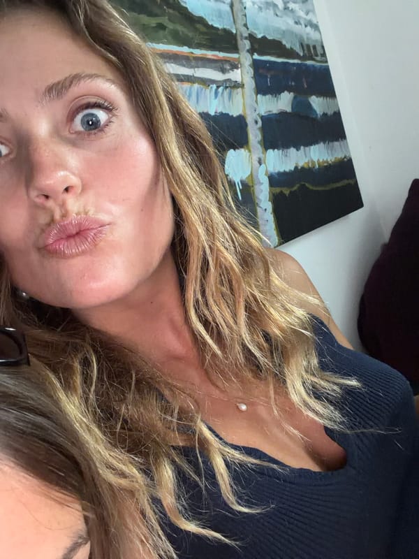 Photos captured of blonde woman and beachgoer in Malibu