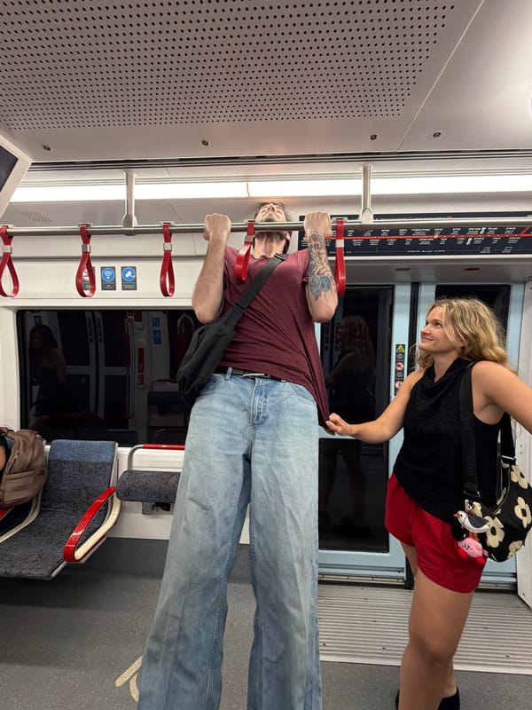 Pull-ups on the overhead bar in a moving transit vehicle