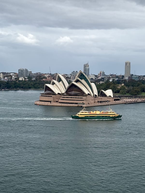 Ferry operates near Sydney Opera House during early morning hours