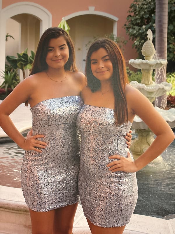 Matching silver dresses, fountain backdrop, Bradenton