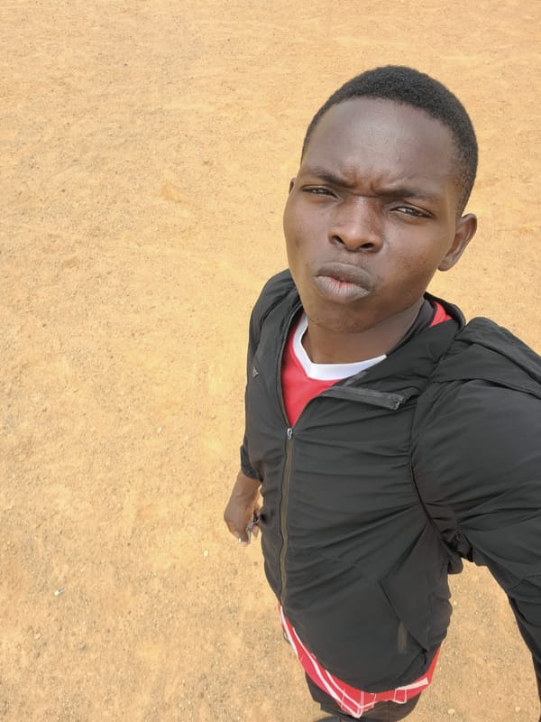 Young men gather for recreational activities in Bukuru field