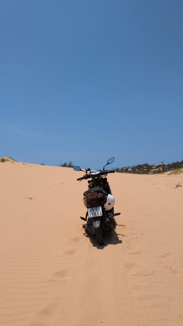Motorcycle parked on sand dunes near Phuoc Dinh, Vietnam