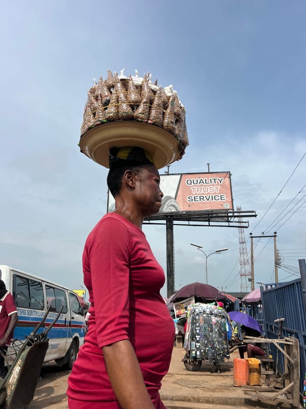 Morning street commerce and transit activity in Onitsha, Nigeria