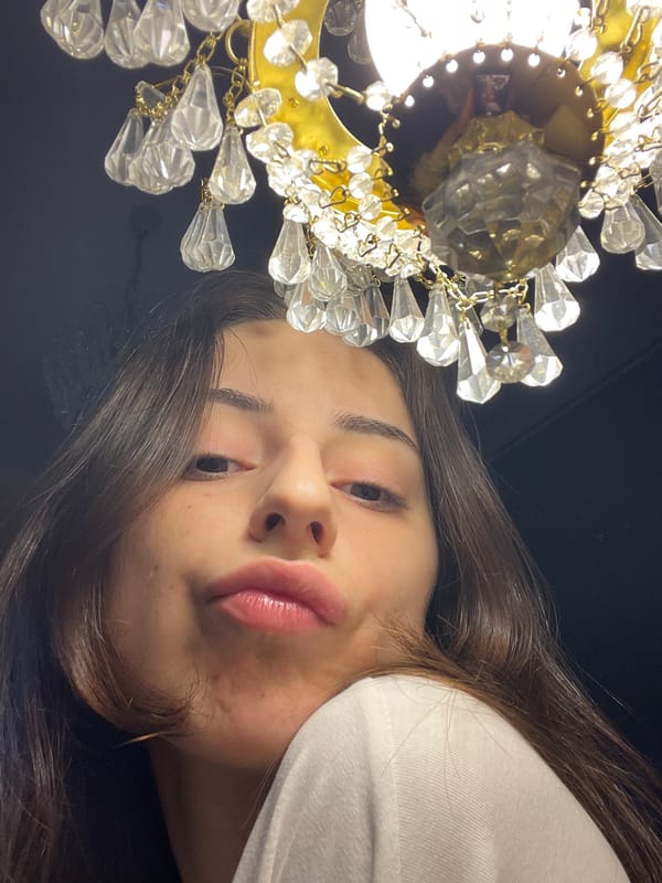 Looking up at a gold crystal chandelier in Moscow