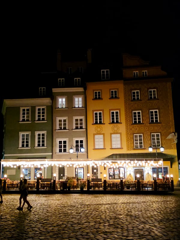 Warsaw's historic center glows on a summer night