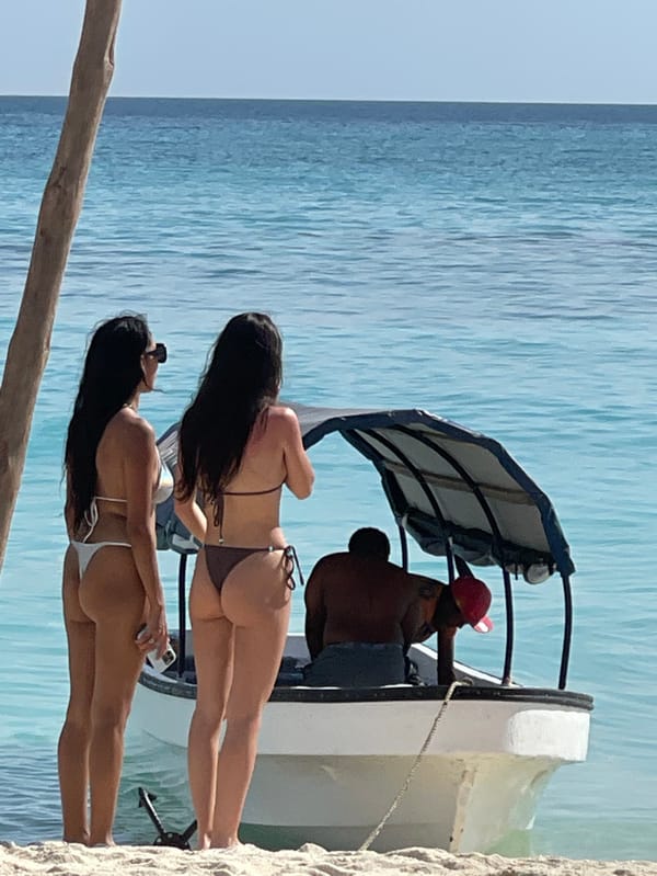 Tourists enjoy sunny beach day activities in Zanzibar