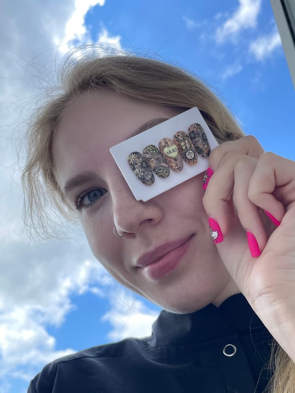 Nail art session documented against blue sky in Izhevsk