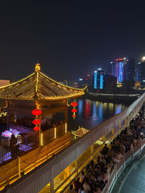 Night cityscape documented along river in Yuzhong District
