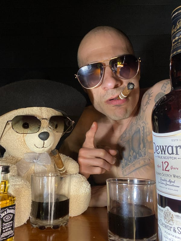 Sunglasses-wearing teddy bear posed with muscular arms in Pleven