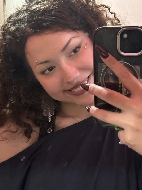 Person photographed holding smartphone in Milan