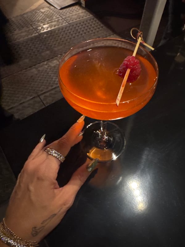 Nighttime crowd gathers at YSL-branded venue with musical setup