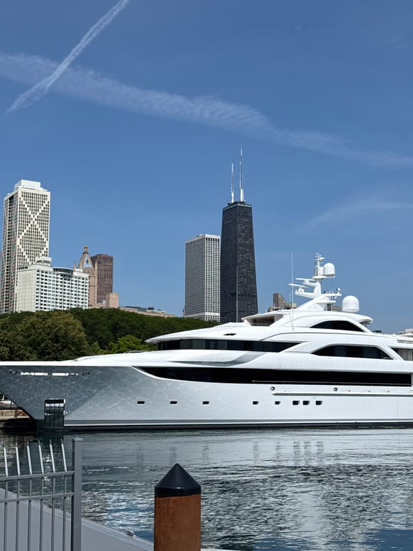 Large white luxury yacht docked at Chicago harbor