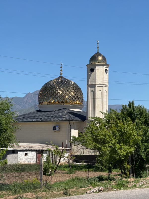 Mosque photographed under clear skies in Tokmok, Kyrgyzstan