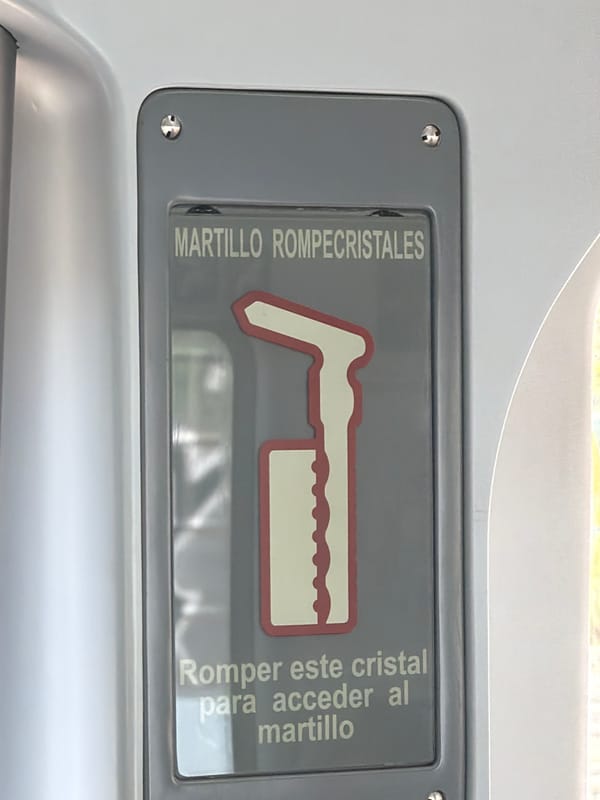 Emergency hammer safety sign spotted in Madrid vehicle