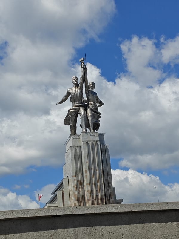 Moscow's iconic Soviet steel monument under a clear summer sky