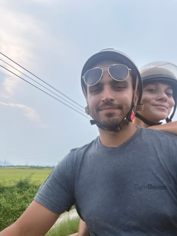 Couple rides scooter in Đà Nẵng, captured in selfie