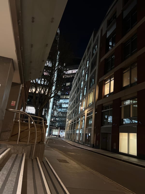 Illuminated London building captured at night