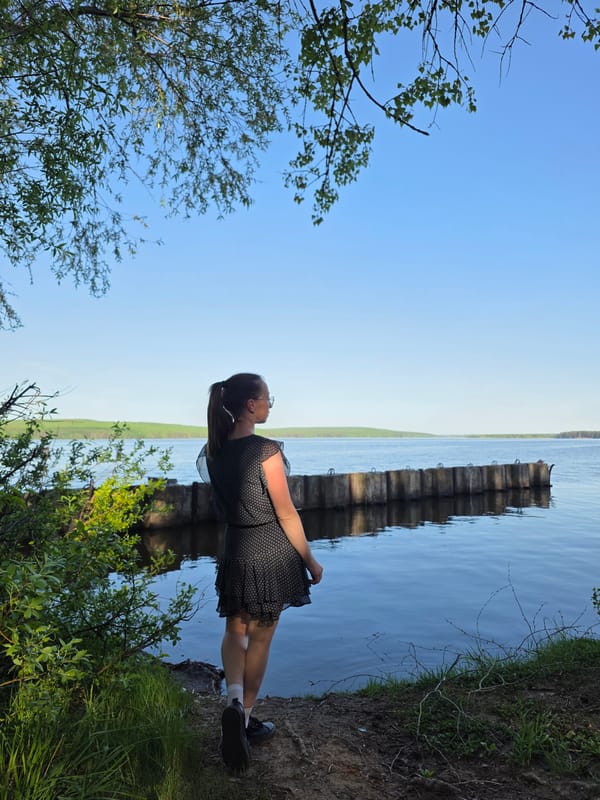 Woman spends afternoon exploring waterfront park in Chaikovsky, Russia