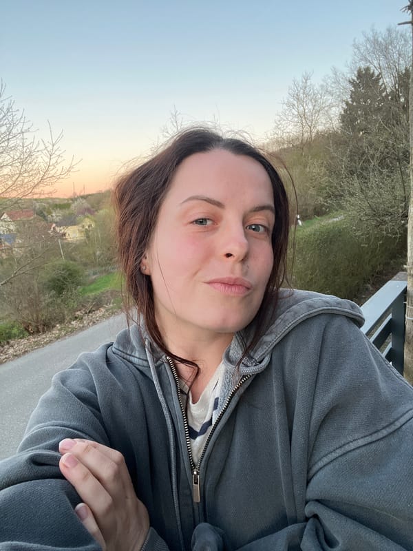 Woman shares sunset moments with corgi in German village