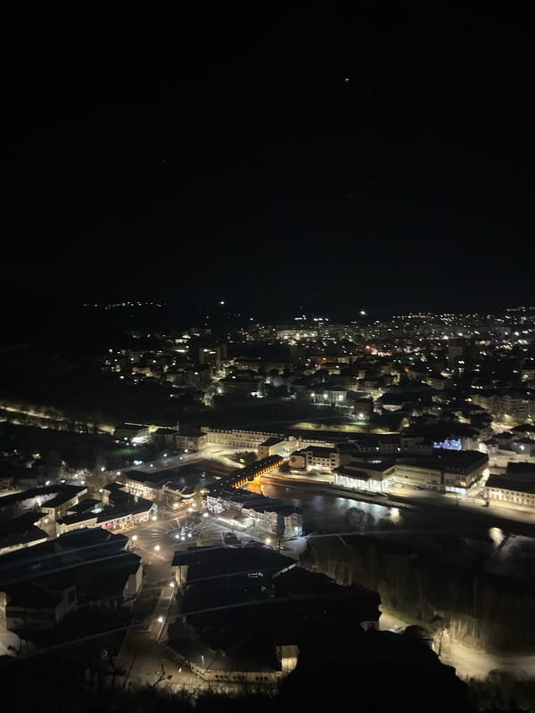 Aerial nighttime view captures illuminated Lovech, Bulgaria from above