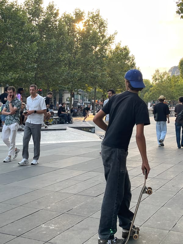 Casual afternoon in a Parisian plaza, toys and lamppost curiosities