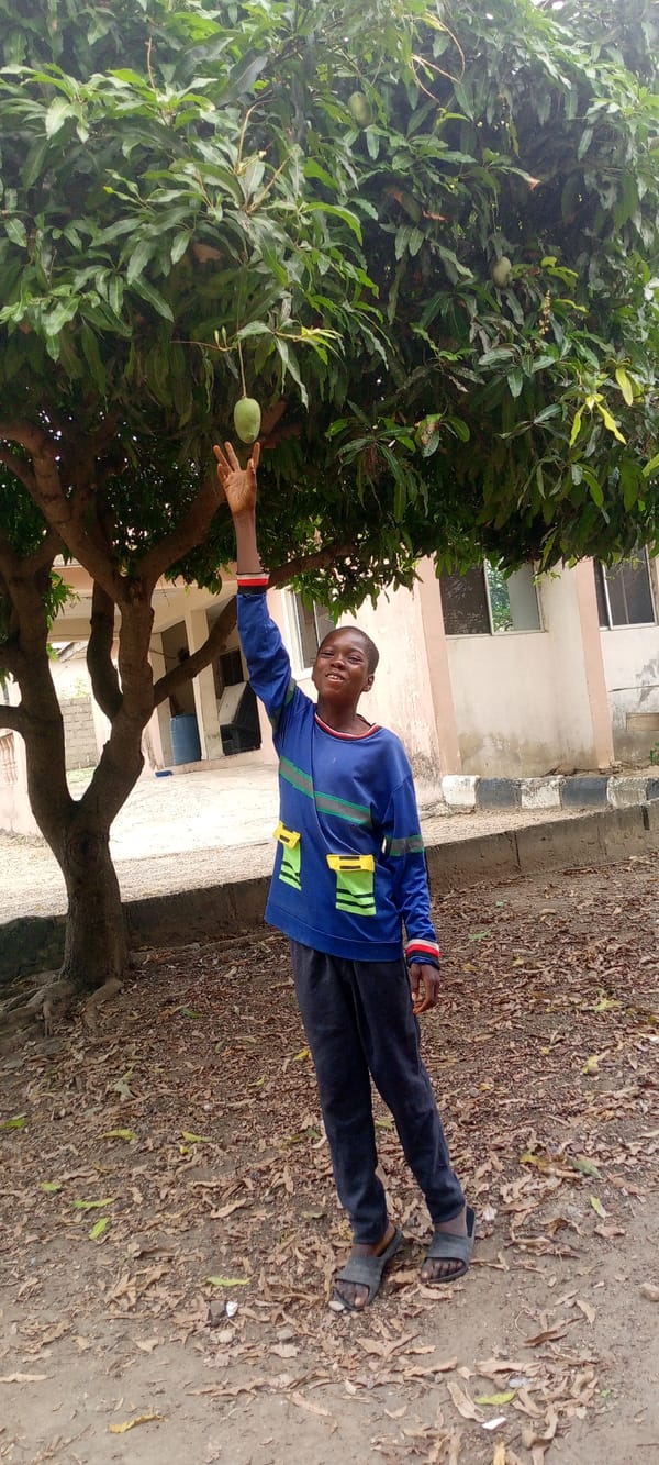 Children play and take photos in Adankolo, Nigeria community