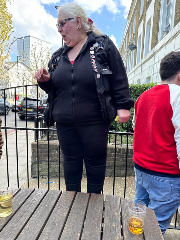 Outdoor drinks gathering observed in London with multiple beverages