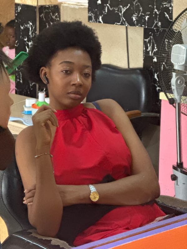 Women receive hair services at Abuja salon Friday afternoon