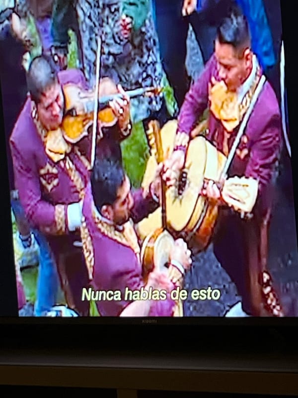 Mariachi band performs in traditional purple suits in Madrid