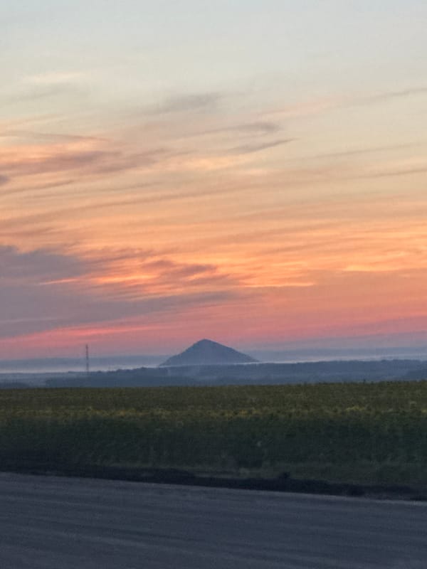 Dusk over open Russian countryside, road and fields at sunset