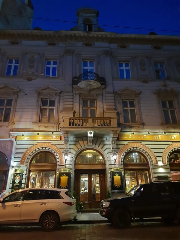 Ornate Lviv building glows at dusk