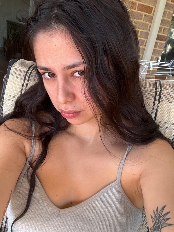 Woman relaxes outdoors, gives thumbs-up in Como morning