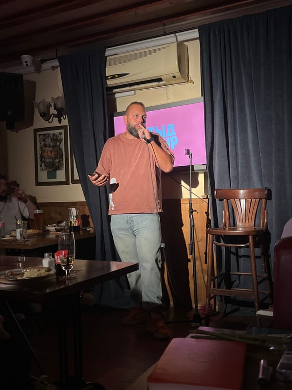 Comedian performs on stage in Tel Aviv entertainment venue