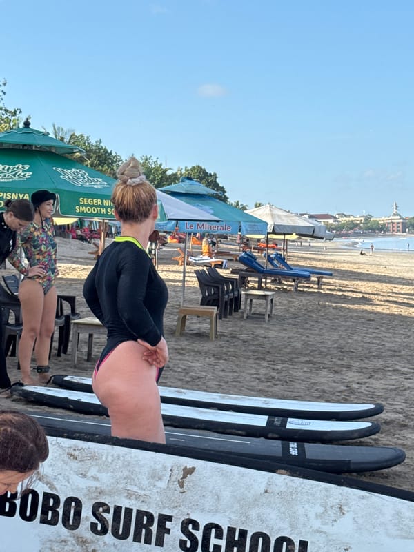 Late-night surf lessons conducted at Kuta Beach, Bali