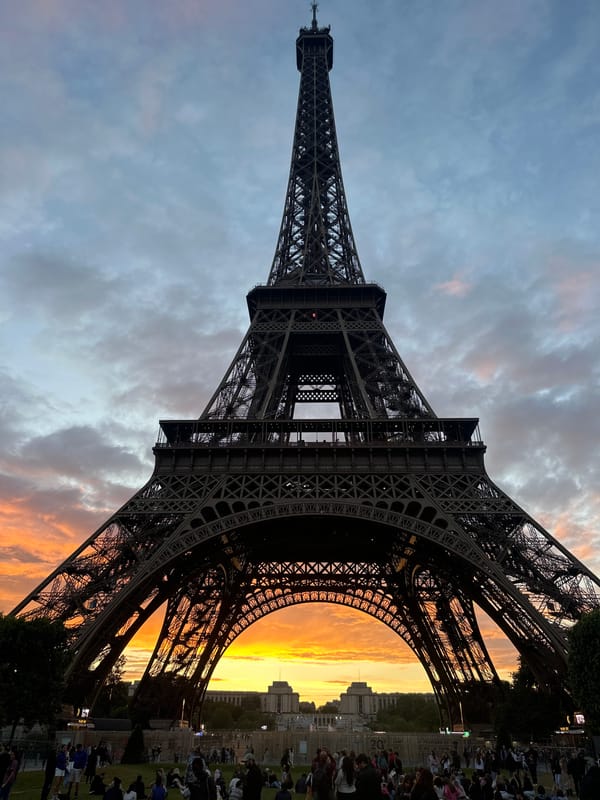 Crowds gather at Eiffel Tower for dramatic sunset viewing