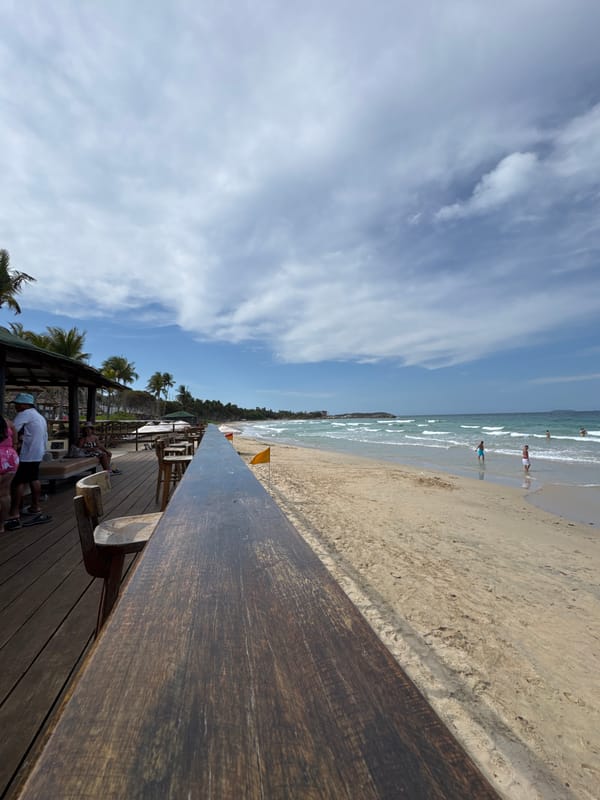 Tourist documents sunny beach vacation day in El Tirano, Venezuela