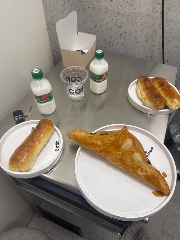 Sausage rolls and pastry documented on plates in Yerevan