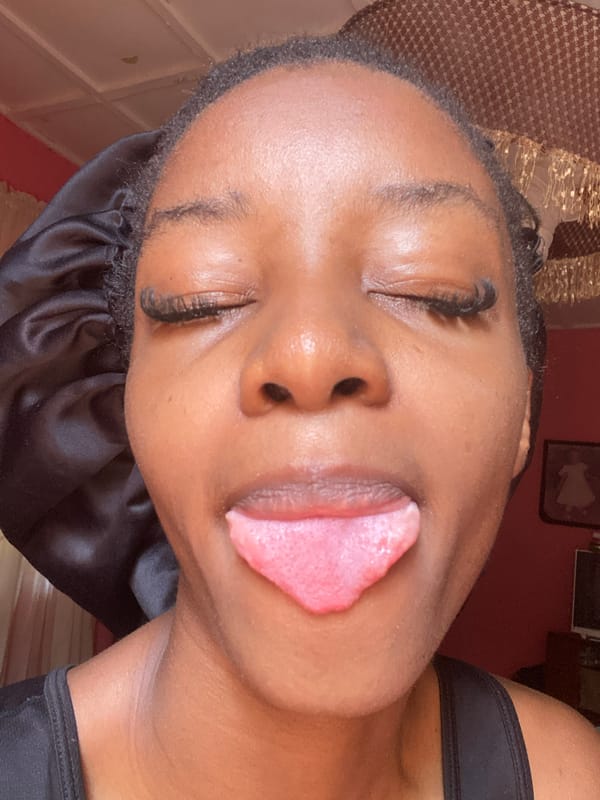 Selfie session in Jos featuring expressive poses and detailed nail art